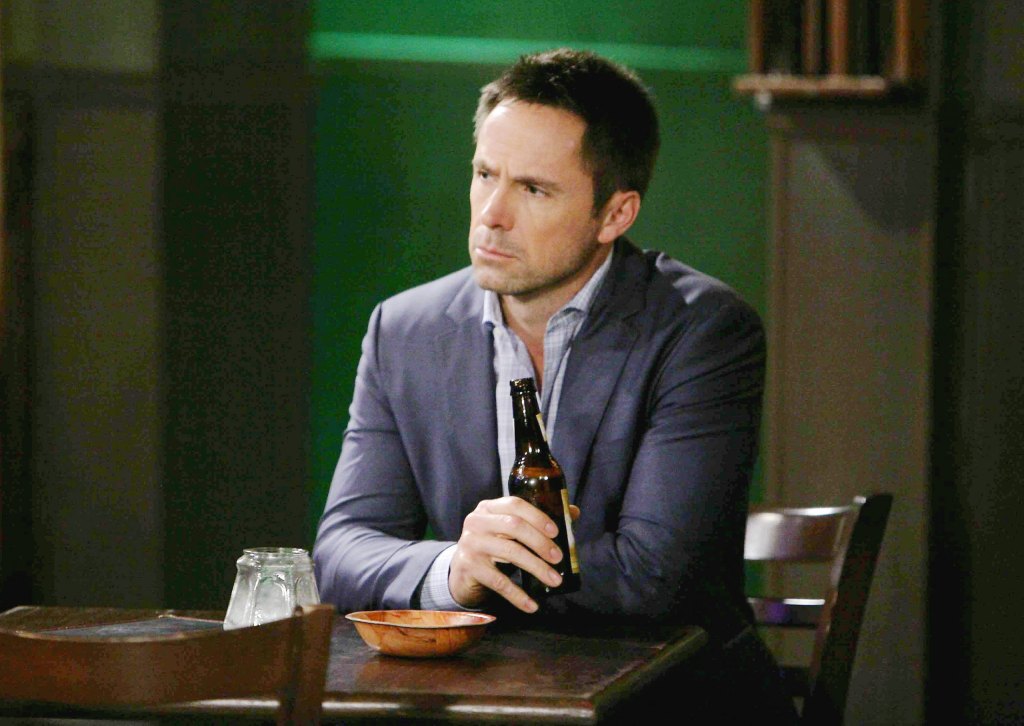 julian jerome holding a drink in a bar on general hospital.