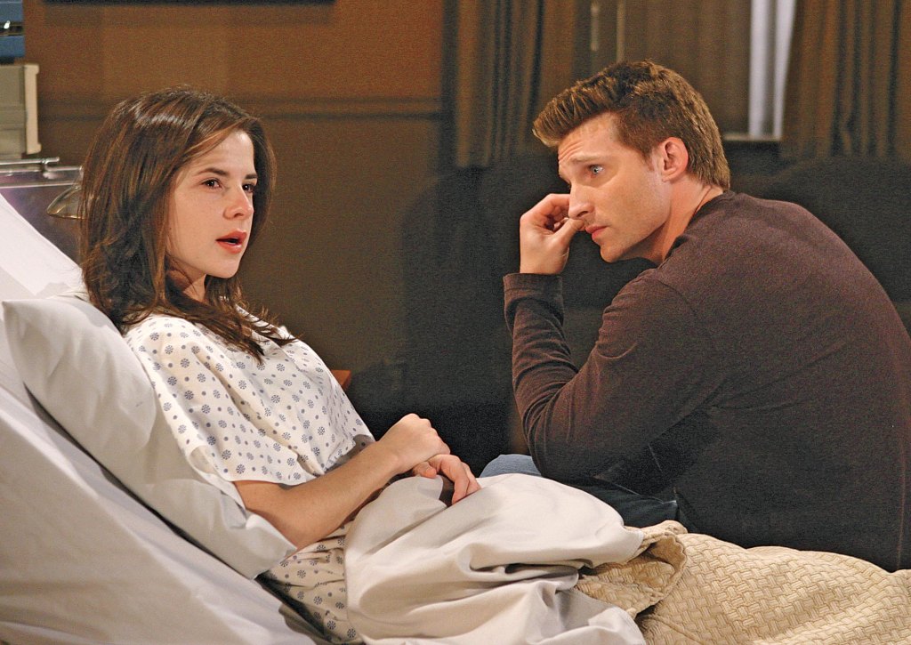 kelly monaco as sam in a hospital bed and steve burton as jason on general hospital.