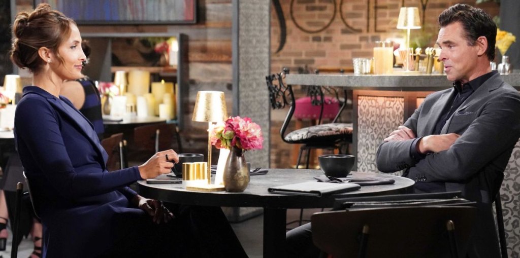 young and restless lily and billy sitting at a table at society.