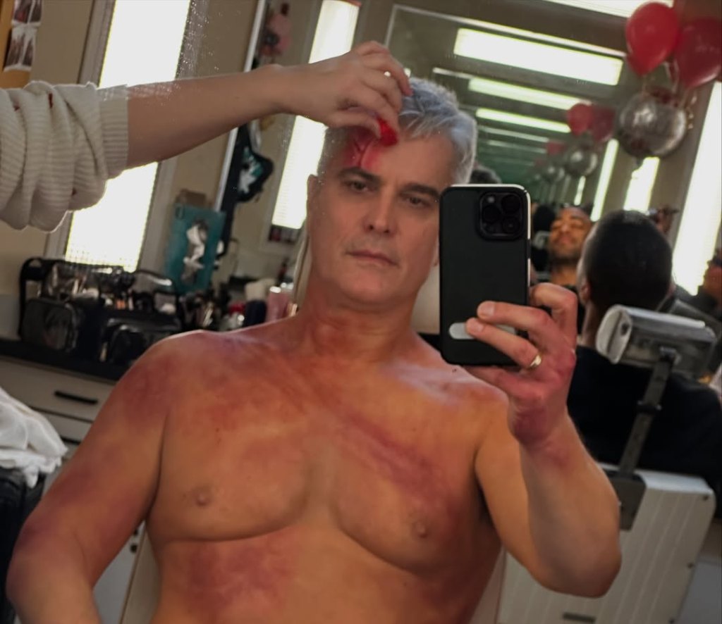 rick hearst shirtless and bloody in the general hospital makeup room.