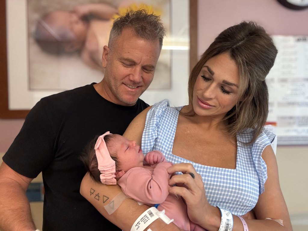 sean carrigan of young and restless poses with fiancée jazmin and daughter susan.