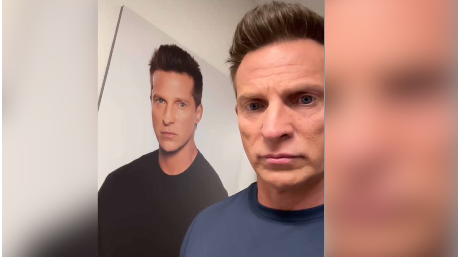 steve burton posing next to a poster of himself.