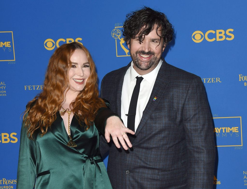Camryn Grimes with fiance Brock Powell showing off her engagement ring in 2022