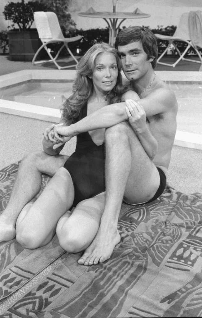 Jaime Lyn Bauer and John McCook posed on the Y&R set, 1978