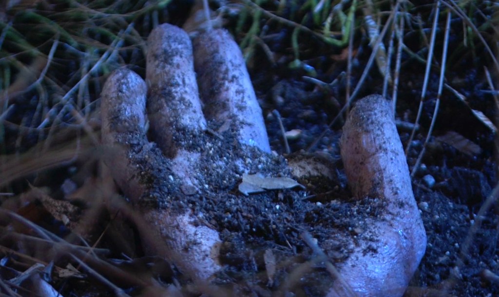 decomposing hand coming out of dirt on general hospital